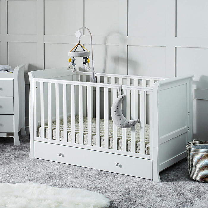 Classic styled white cot bed with storage drawer beneath by Ickle Bubba