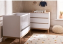 Modern mini 2 piece nursery room set includes mini cot bed and 3 drawer changing unit. White and natural finish.