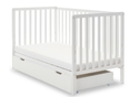 White wooden cot bed with open slat design and teething rails. Pull out drawer on castors under the cot.