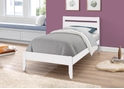 A contemporary style white wooden bed frame, horizontal slatted headboard and tapered legs