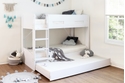 Modern white bunk bed with a pull out trundle drawer. Integrated ladder with deep treads and grab handles.