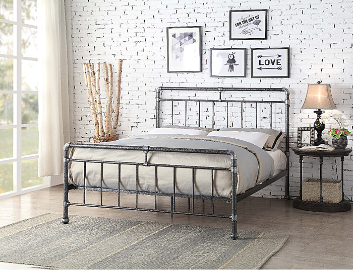 Contemporary, industrial style metal bed frame with pipe joint detailing and a rugged textured look. Silver and black finish.