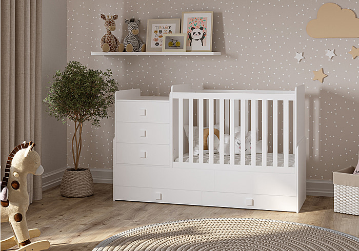 White cot with an attached changing unit and 4 drawers. Modern design. Adapts to a toddler bed. by Kidsaw