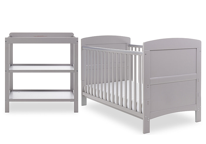 Two piece warm grey nursery set comprising cot bed and open changing unit. Cot has open slatted sides and 3 height positions.