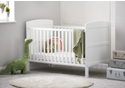 White cot bed with open slatted sides, solid end panels and 3 height positions. Teething rails included.