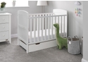 Stylish white wooden cot bed with under drawer, open slatted sides and solid curved end panels. Includes teething rails.