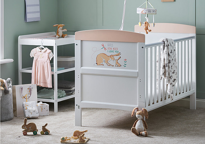 White cot bed beautifully illustrated with a rabbit design, teething rails included, 3 base height options