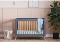 Scandinavian style mini cot bed with a slate and natural finish. 3 base height positions. Transforms to a junior bed.