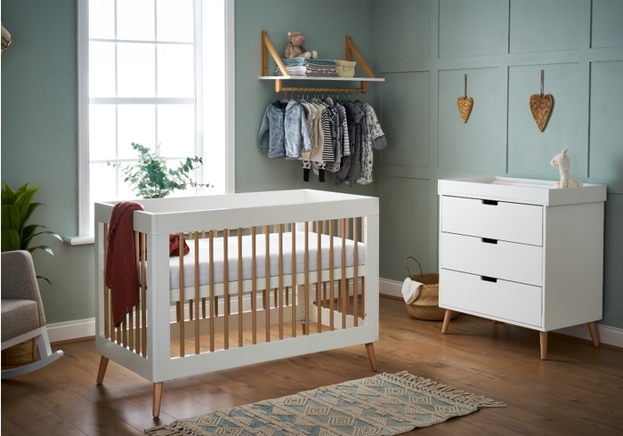 Scandinavian style white and natural 2 piece mini room set including a mini cot bed and 3 drawer changing unit.