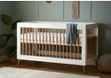 Modern Scandinavian design cot bed in a white and natural finish with a 3 base height positions.