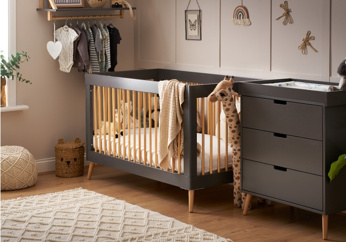 Scandinavian style two piece room set in grey and natural. Cot bed and 3 drawer changing unit.