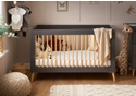 Modern Scandinavian design cot bed in a slate and  and natural finish with a 3 base height positions.
