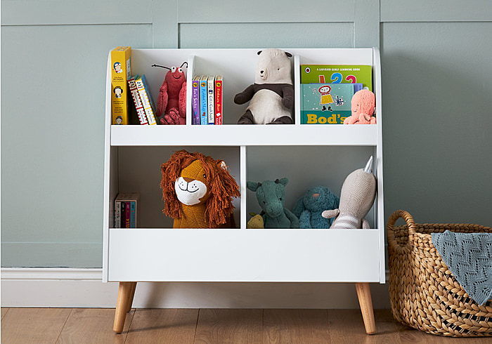 Scandinavian style toy storage unit with 5 compartments. Clean white finish with natural angled legs.