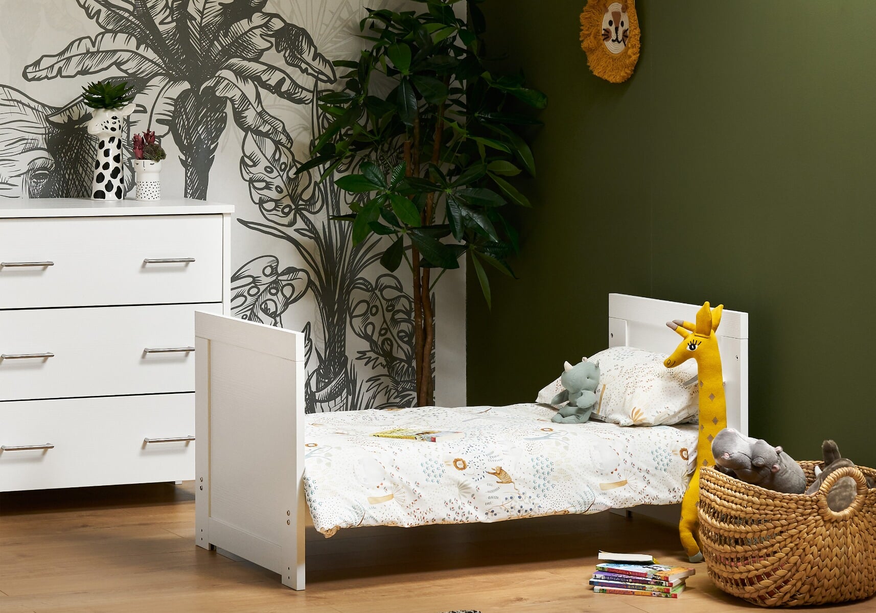 white adaptable cot that is in bed form