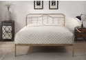 Antique bronze metal bed frame with a curved headboard and low foot end. Elegant, minimal design