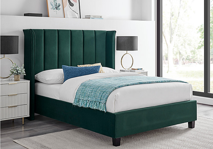 Luxury emerald green recylced fabric velvet bed frame. Tall winged padded headboard and low footend.