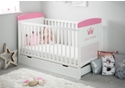 White cot bed with under drawer. A royal themed design in pink, teething rails, 3 height adjustable base