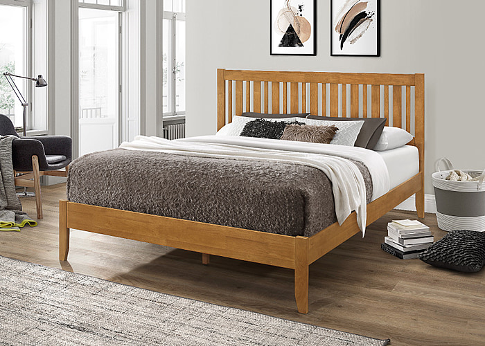 Contemporary wooden bed frame with a modern slatted headboard and tapered legs