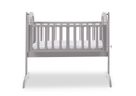 A beautiful warm grey coloured swinging baby crib with open slatted sides.