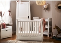 Elegant sleigh design white 3 piece nursery set. Cot bed with drawer, open changing unit and wardrobe.