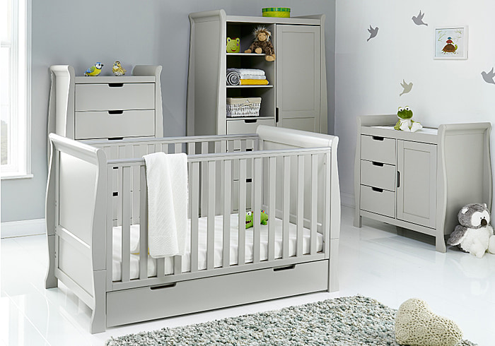 Elegant grey sleigh style 4 piece room set comprising, tall chest of drawers, cot bed with drawer, double wardrobe and changing unit.