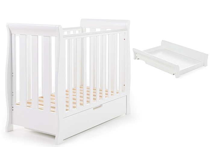 White, elegant sleigh style space saver cot with cot top changer and under drawer, 3 base heights, teething rails and open slatted sides.