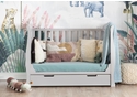 Elegant, sleigh style mini cot bed in a grey finish with under drawer. 3 base heights, teething rails, open slatted sides.