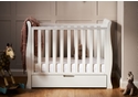 White elegant sleigh style space saver cot with under drawer. 3 base heights, teething rails and open slatted sides.