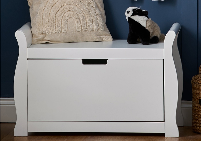 Elegant white sleigh style toy box with one large drawer and recessed handle.