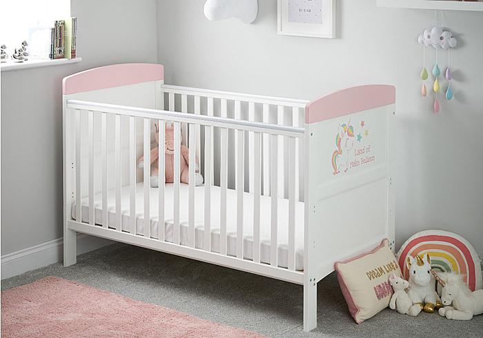 White cot bed with colourful unicorn design, teething rails included, 3 base height options