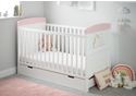 White cot bed with under drawer. A colourful unicorn themed design, teething rails, 3 height adjustable base