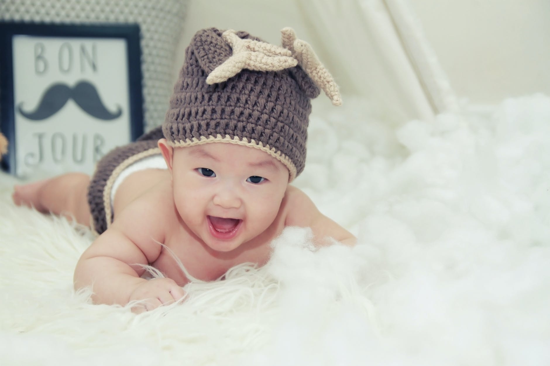 Laughing Baby in a hat